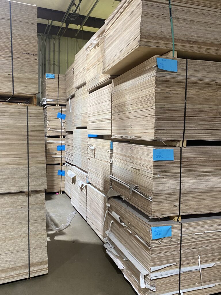 Lauan plywood panels stacked in Lakeland Pallets Indiana facility