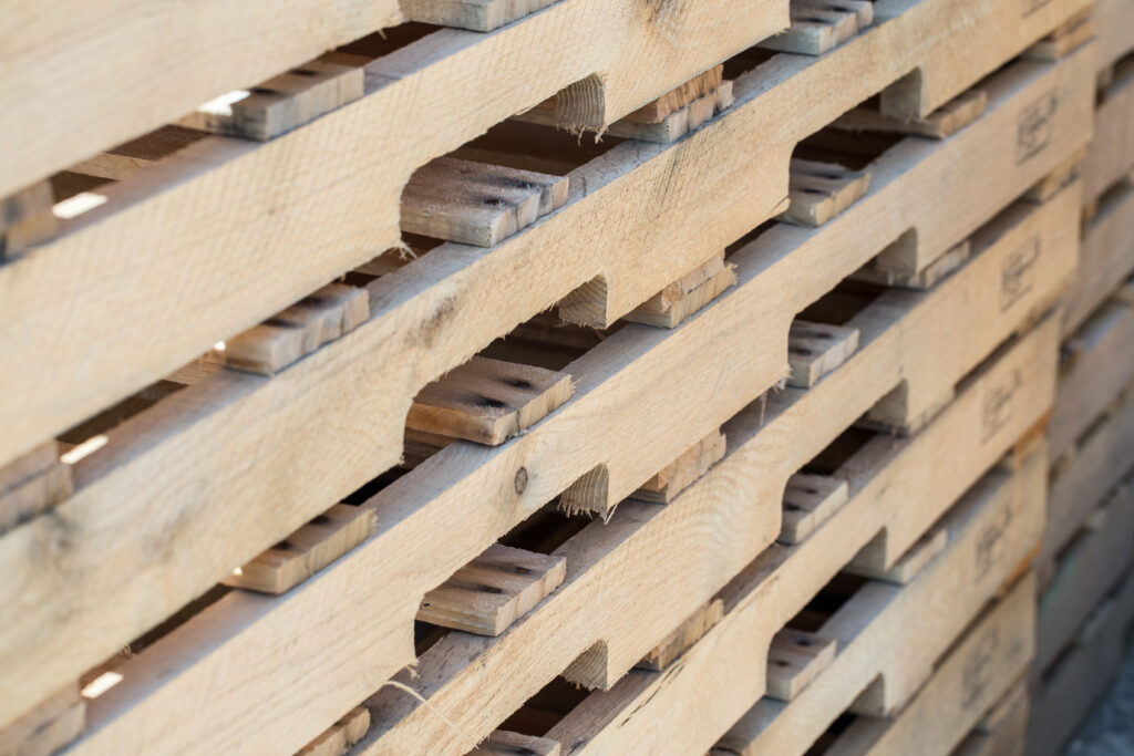 Closeup of custom-built, heat-treated pallets in a stack.